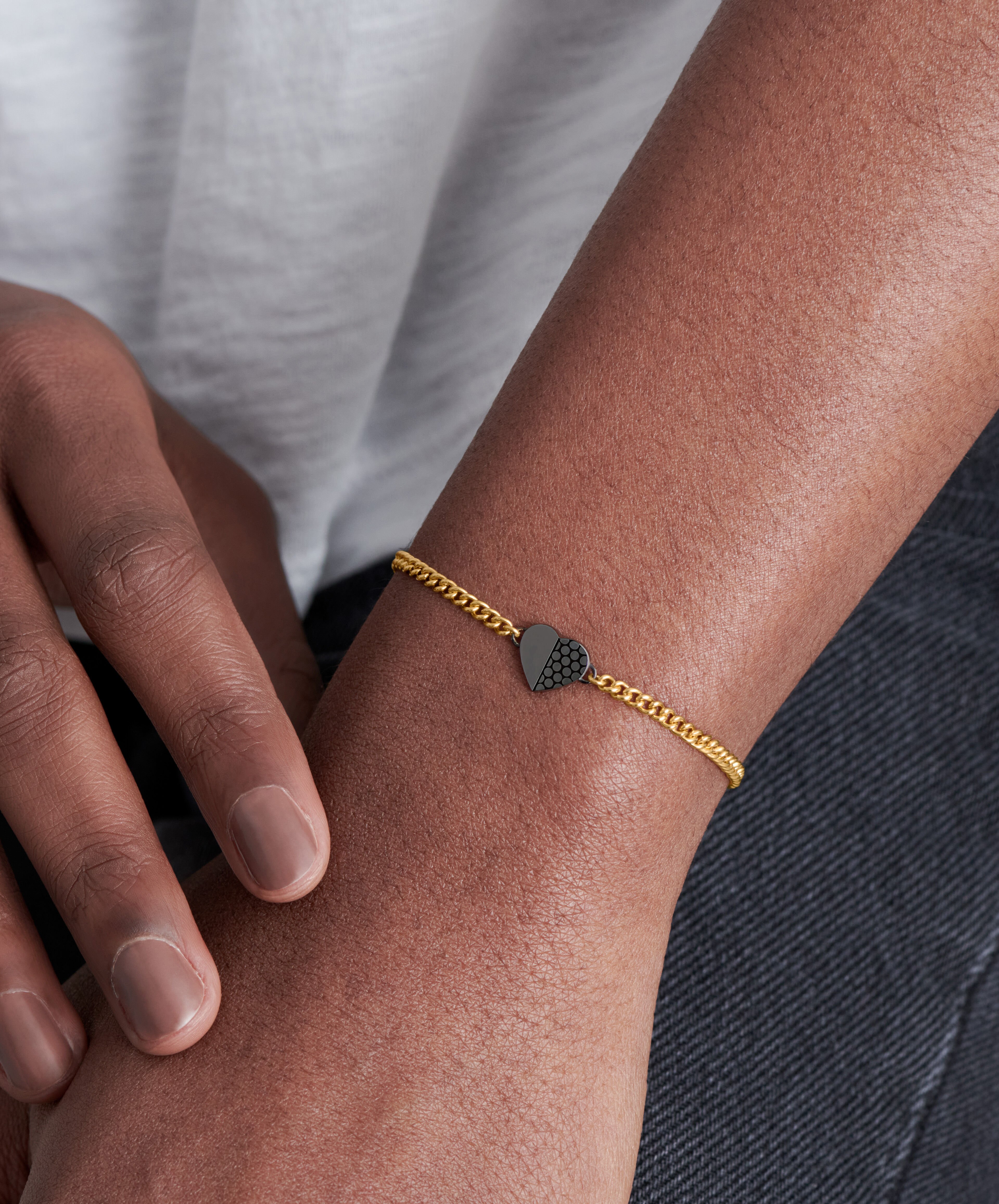 Movado Movado Petite Heart Collection gold bracelet with black heart